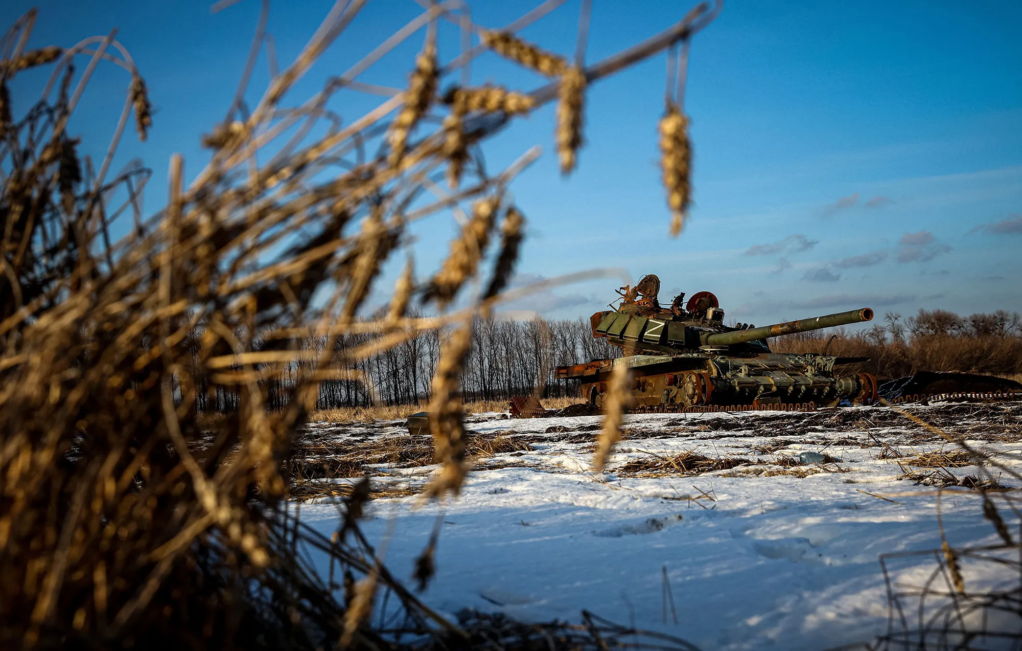 A destroyed Russian tank sits in a snow covered wheat field in the Kharkiv region of Ukraine on Feb.&nbsp;22.