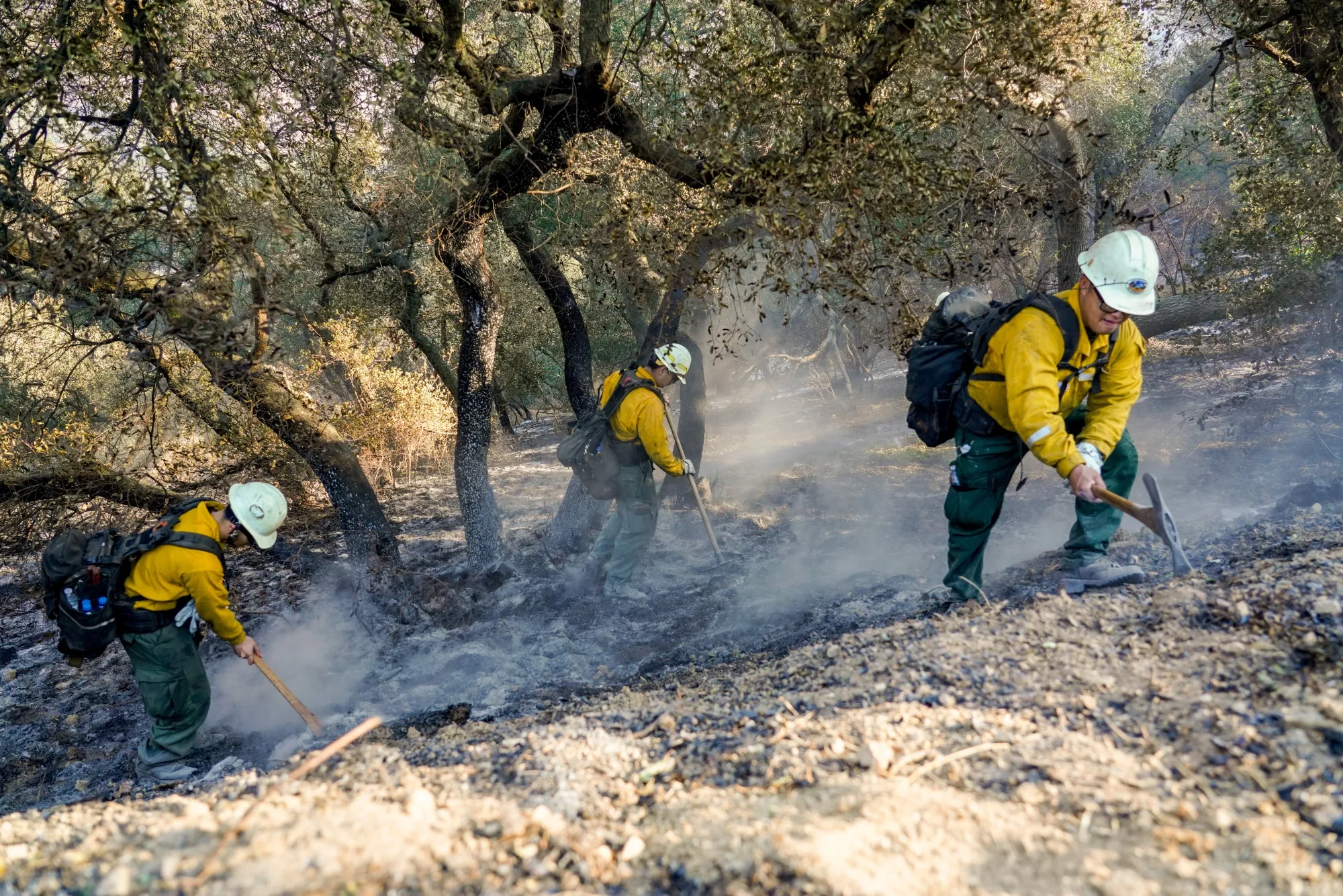 Firefighters work to contain hot spots during the aftermath of the Eaton Fire in Altadena, California, on Jan. 11.