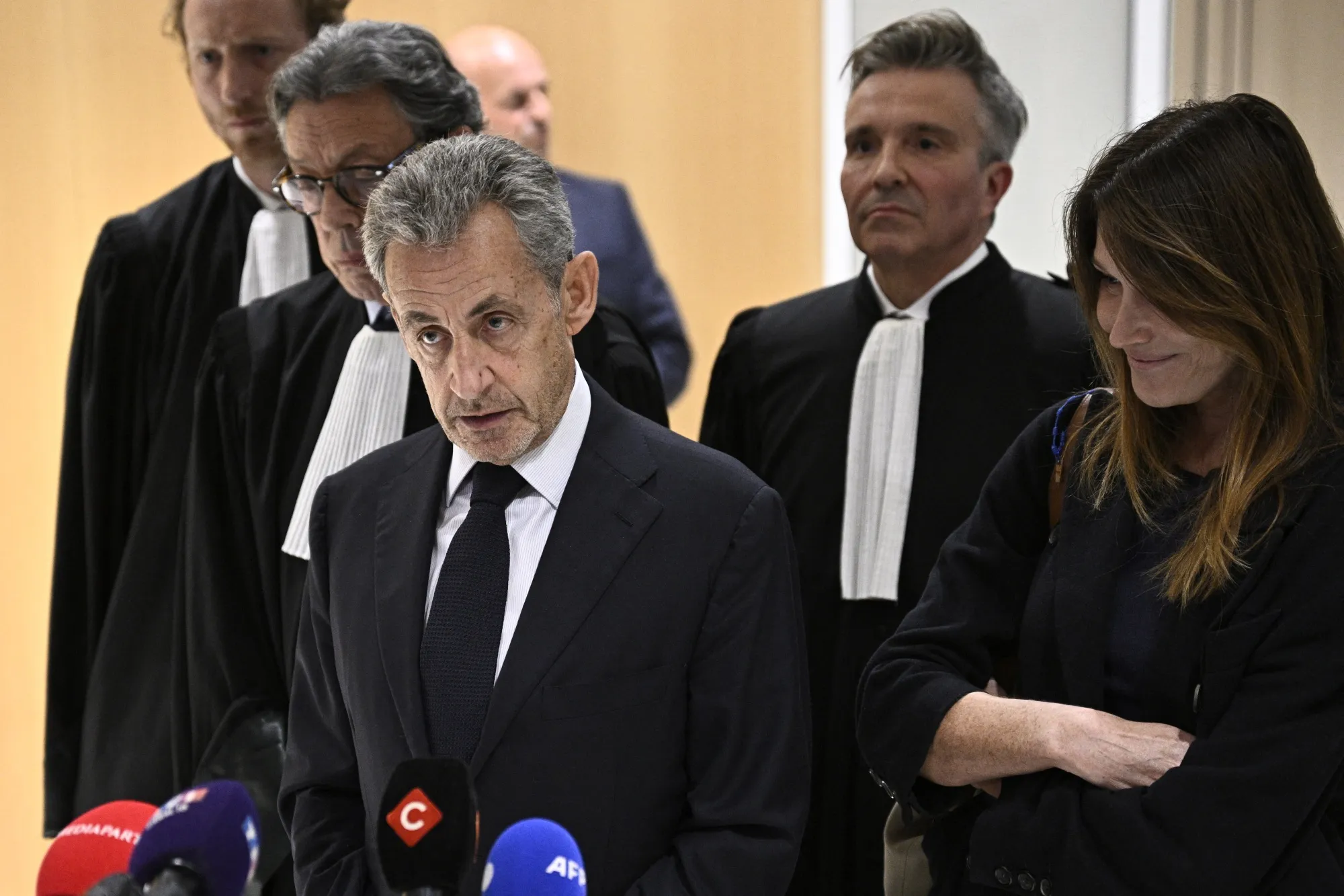 Former French president Nicolas Sarkozy speaks to the press&nbsp;after the verdict in his trial at the Tribunal de Paris courthouse in Paris on Sept. 25.