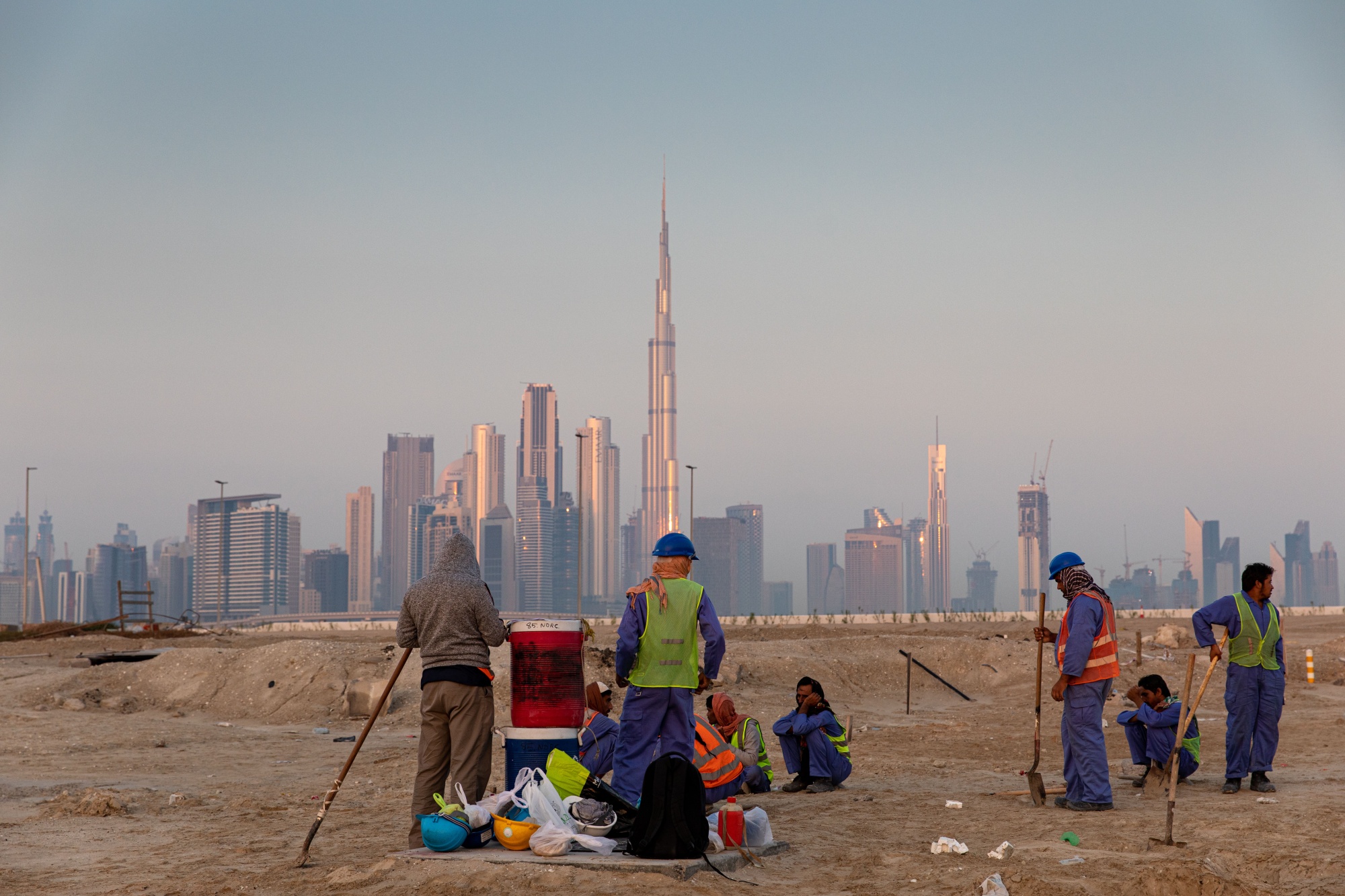 Workers take a break at a construction site in Dubai in 2019.&nbsp;