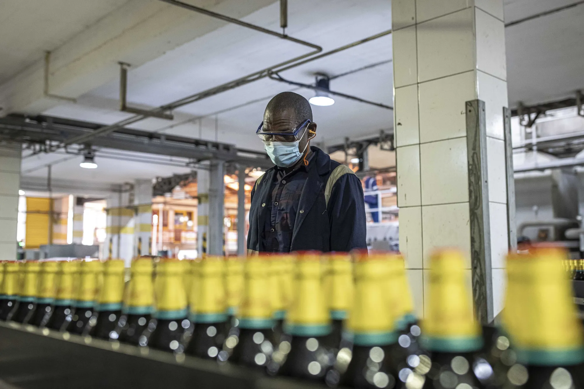 Beer production at a bottling plant, operated by East Africa Breweries Ltd., in Nairobi.