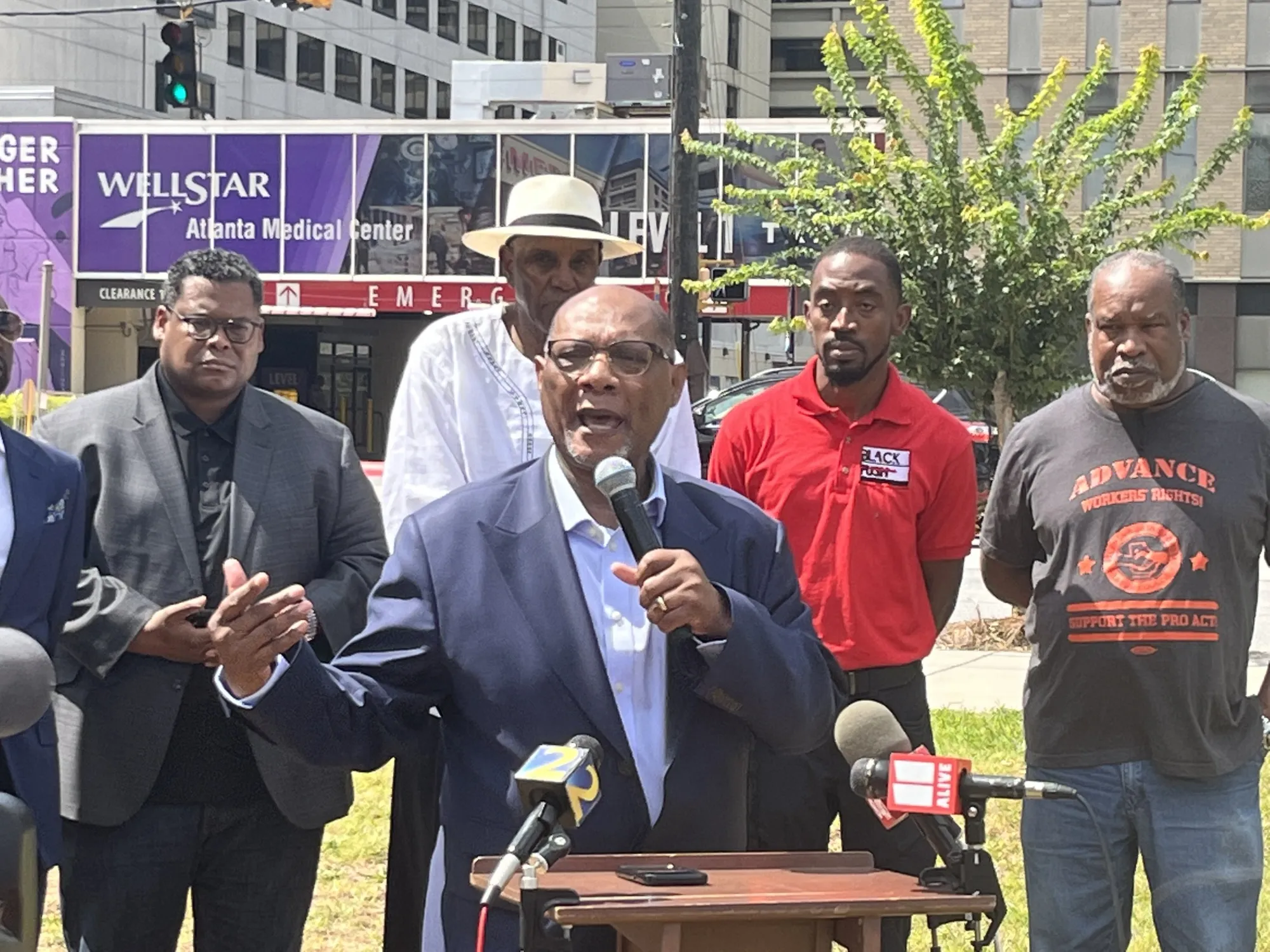 Bishop Reginald T. Jackson is joined by other faith leaders outside Atlanta Medical Center.
