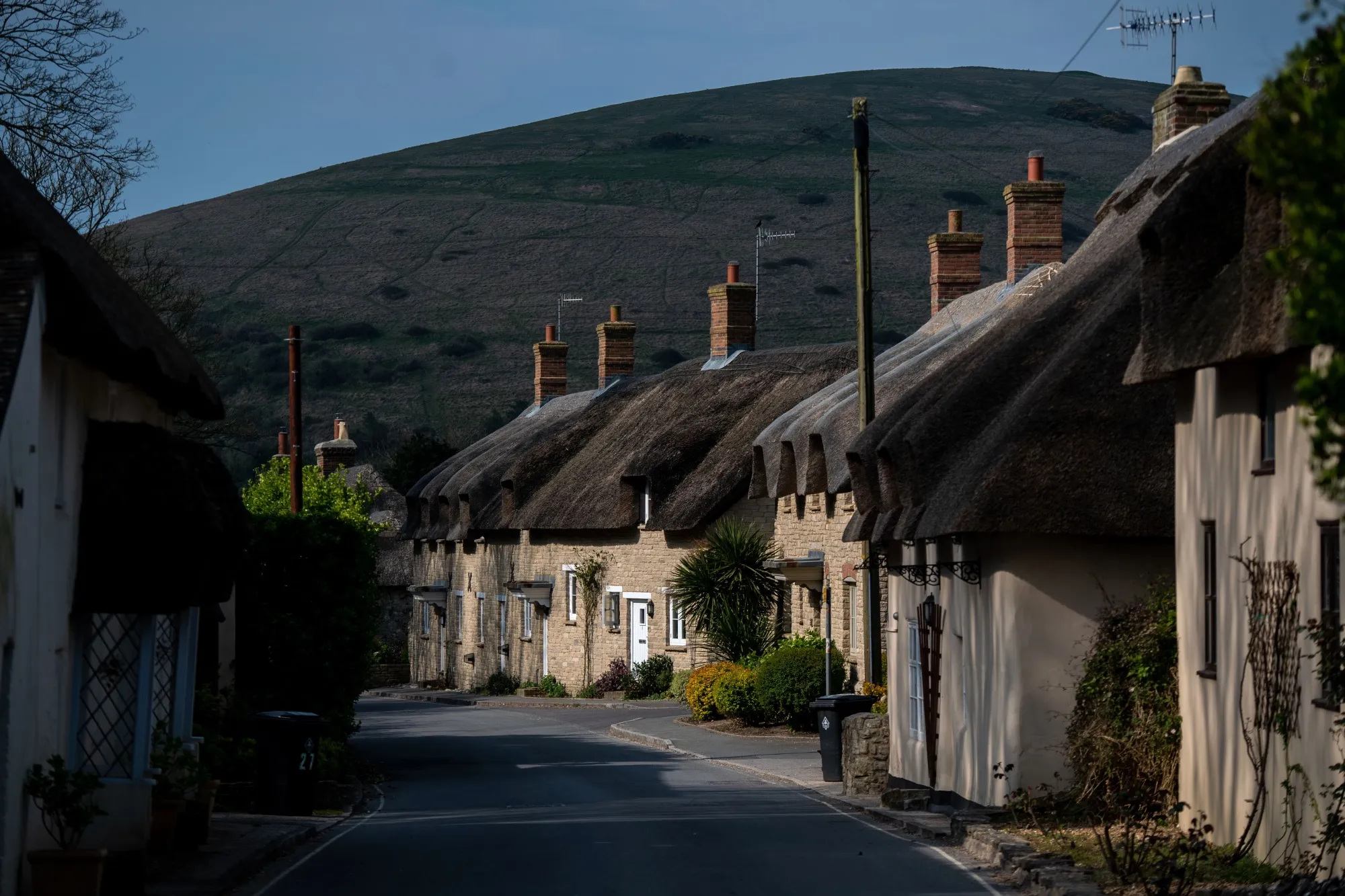 Thatched cottages line an empty road during the national lockdown in the village of West Lulworth, U.K., on April 10.