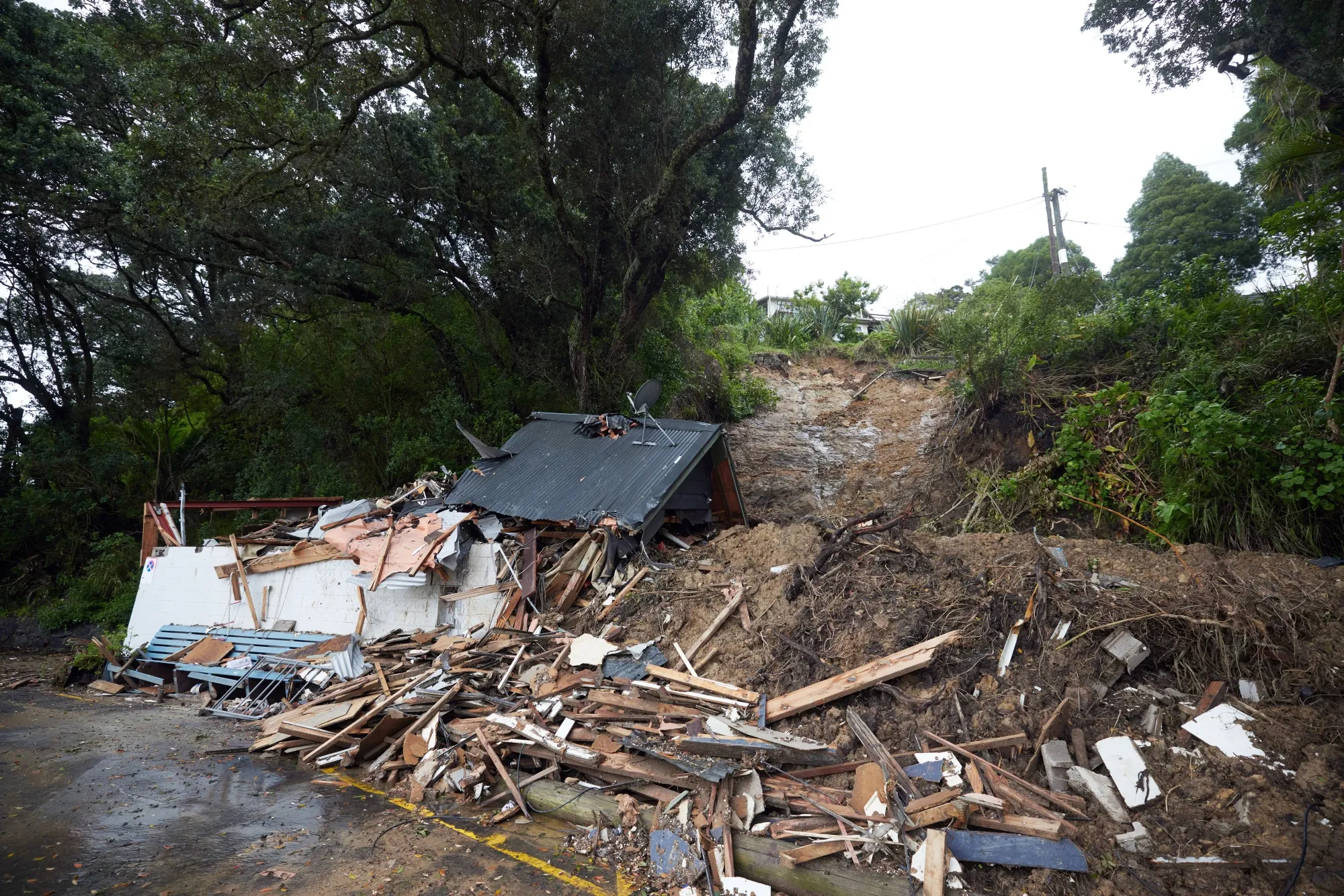 A damaged house following Cyclone Gabrielle in Auckland, New Zealand.