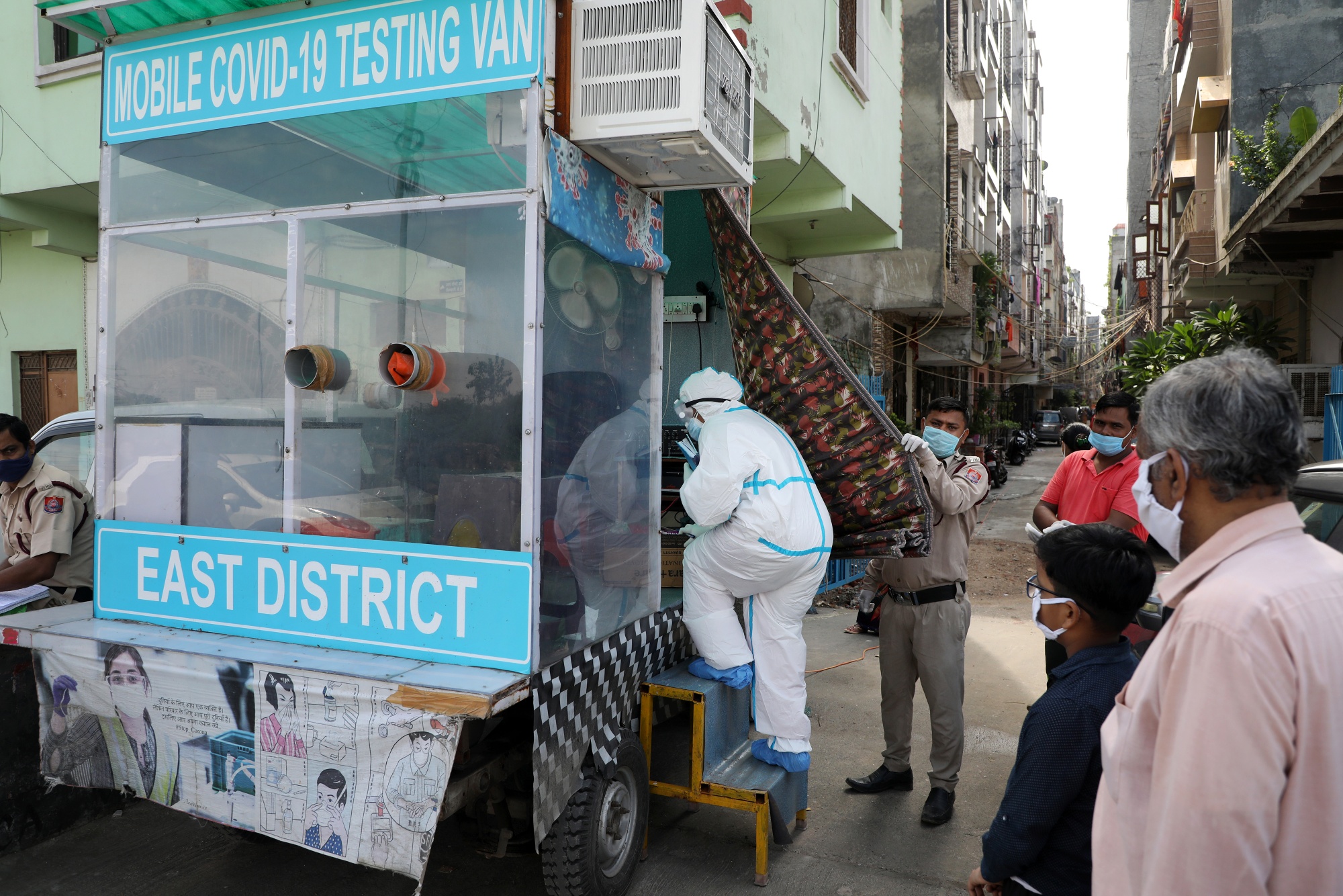 A health worker arrives at a mobile Covid-19 testing van in New Delhi, Aug. 16.