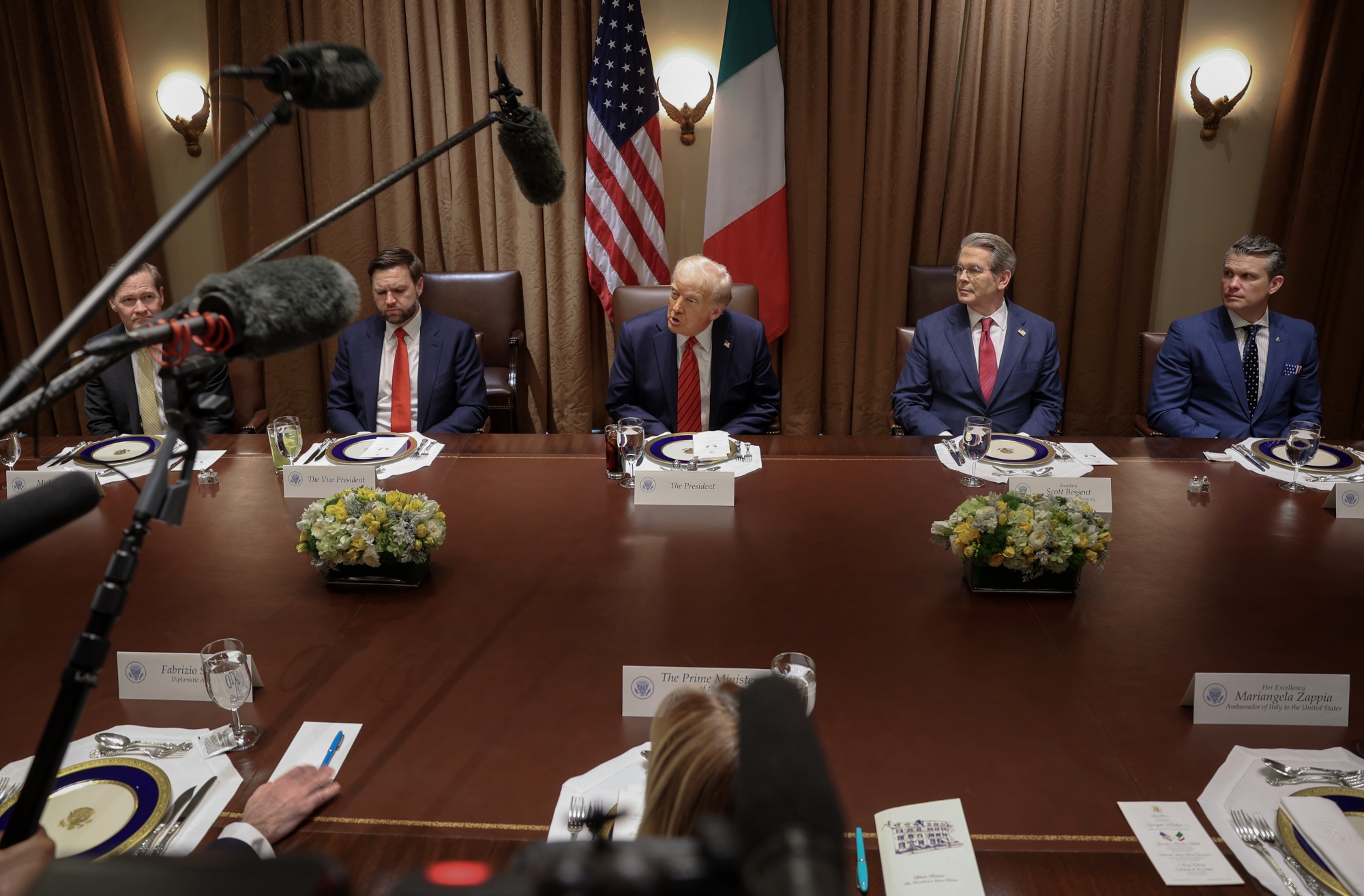 WASHINGTON, DC - APRIL 17: U.S. President Donald Trump and members of his cabinet (L-R) National Security Advisor Michael Waltz, Vice President JD Vance, Treasury Secretary Scott Bessent and Defense Secretary Pete Hegseth host Italian Prime Minister Giorgia Meloni and her fellow officials for lunch in the Cabinet Room at the White House on April 17, 2025 in Washington, DC. Leader of the far-right Brothers of Italy party, Meloni is in Washington to discuss a range of bilateral issues, negotiate the 20 percent “reciprocal” tariff Trump imposed on European imports to the U.S., and to discuss pharmaceutical imports. (Photo by Win McNamee/Getty Images)
