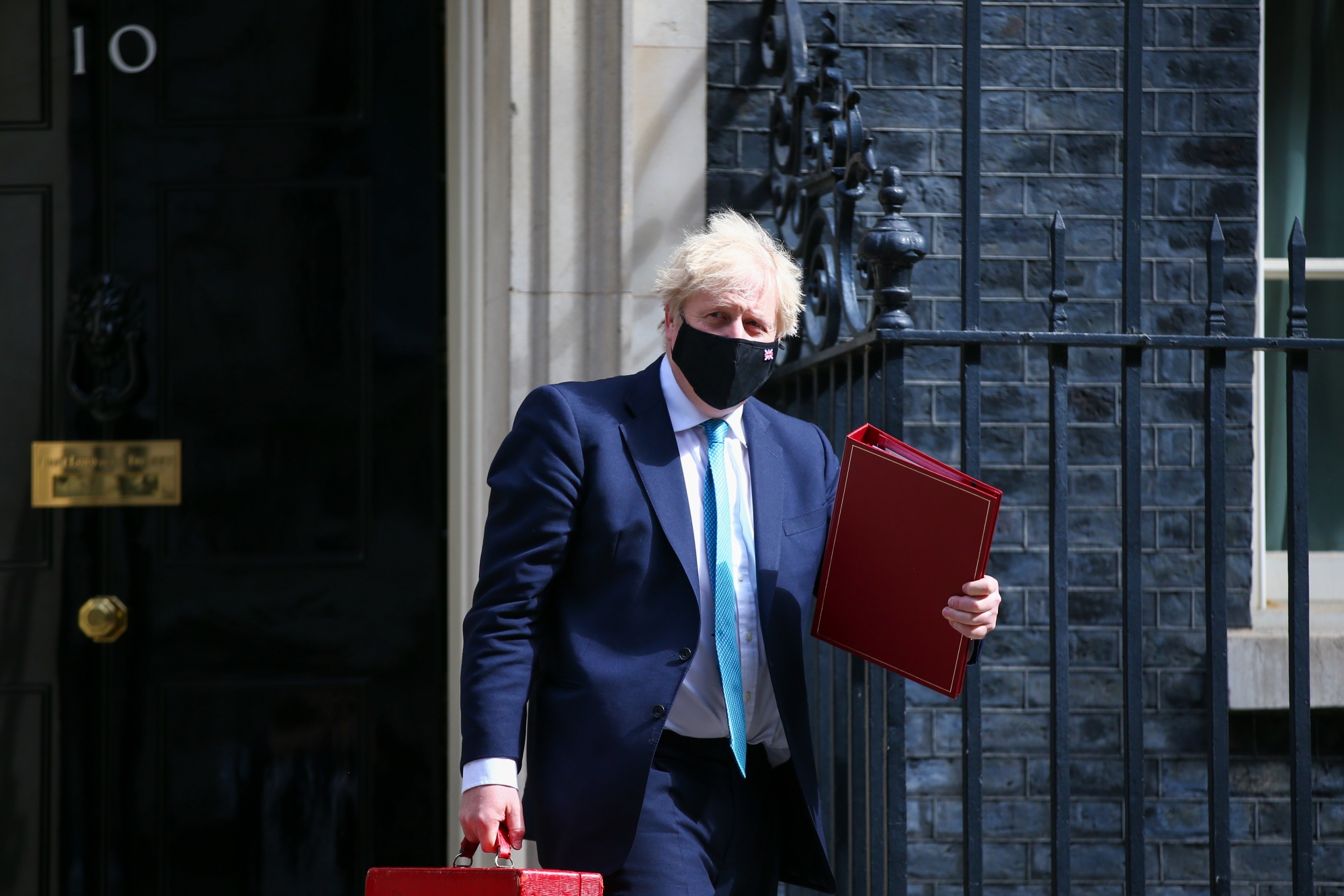 Boris Johnson leaves 10 Downing Street to attend the State Opening of Parliament in London, on May 11.