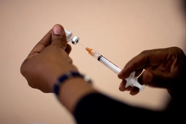 Companies should make their workers get the shot or be tested —&nbsp;right away.