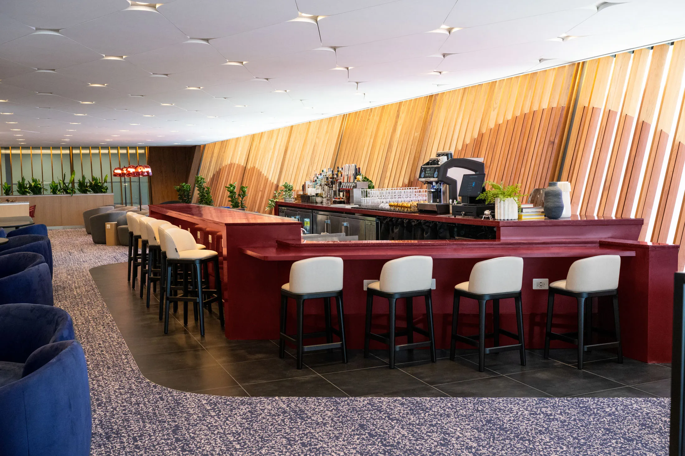 A full bar at Capital One’s new lounge at Dulles International Airport, where it’s more about leisure than work.