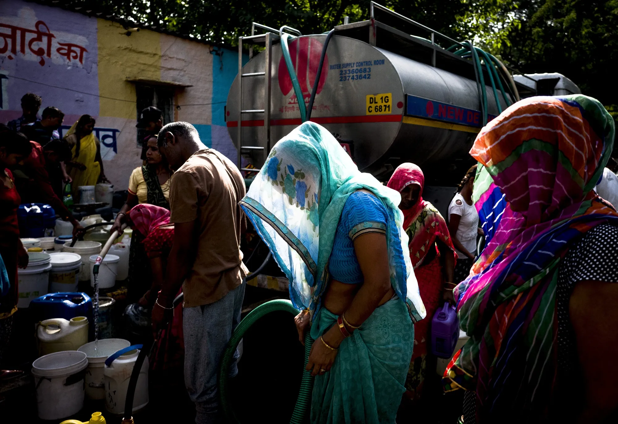 Residents fill water from a Delhi Municipal Corp. truck in New Delhi, on&nbsp;April 30.
