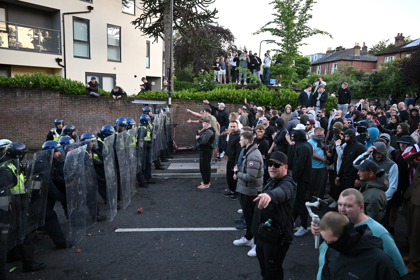 Protesters confront riot police as they gather near the location where Henry Nowak died during a demonstration over the Police's handling of the incident in Southampton, England on June 2. 