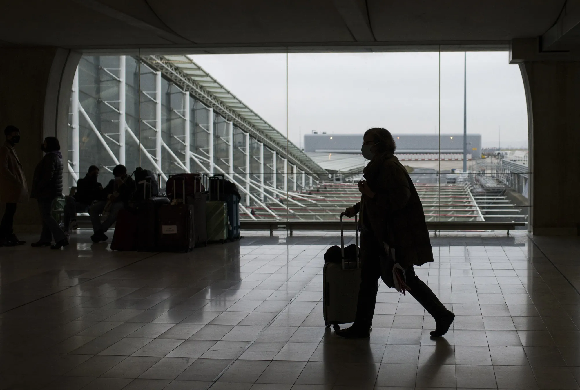 A passenger wheels luggage at Paris-Charles de Gaulle airport in Paris.