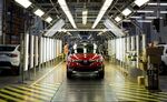 Workers perform quality control inspections on completed Renault Captur crossover sport utility vehicles (SUV) on the production line inside the Renault SA automobile plant in Moscow.