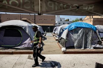 A homeless site of camping tents, in south central, Los Angeles, administered by Urban Alchemy, a San Francisco-based homeless services nonprofit