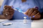 A healthcare worker prepares a dose of the Pfizer-BioNTech Covid-19 vaccine in Philadelphia, Pennsylvania.