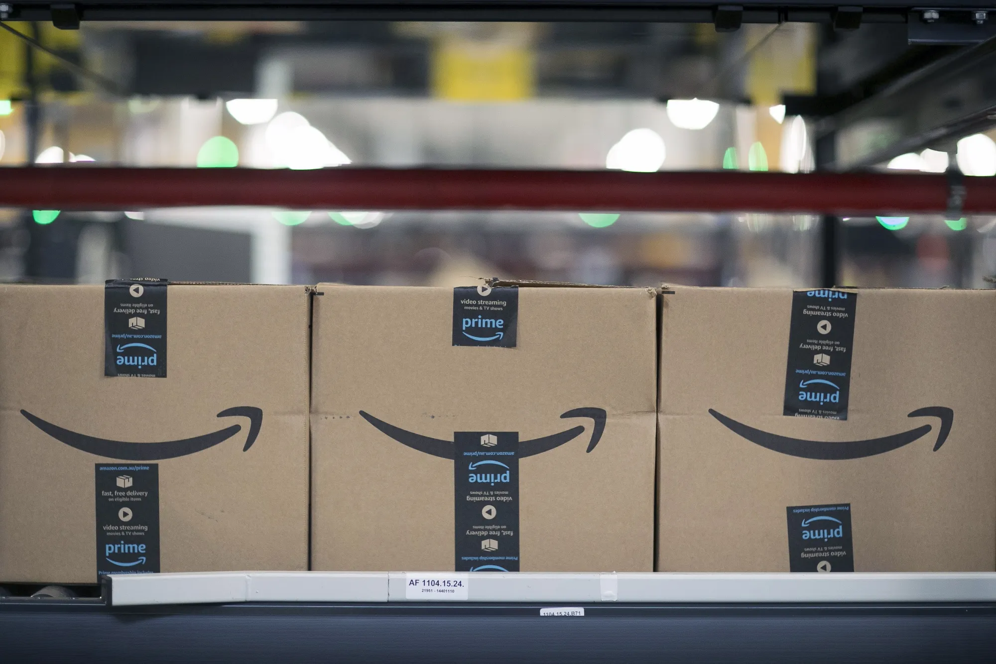 Boxes on a conveyor belt at an Amazon fulfillment center.