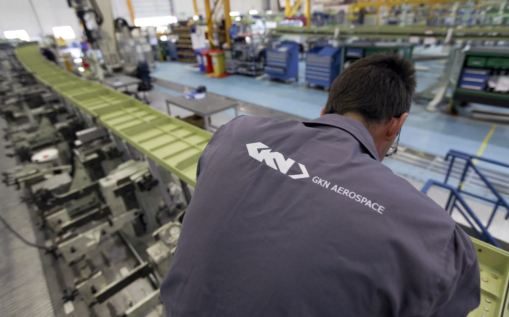 A GKN employee works on a trailing wing edge of an Airbus SAS A380 aircraft.