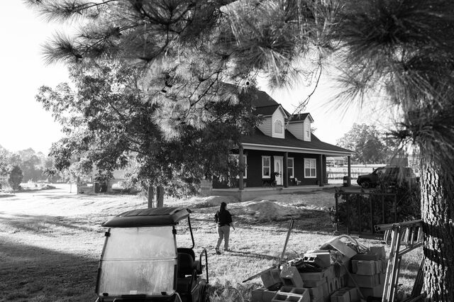 Nunez walks outside her home past construction machinery. 
