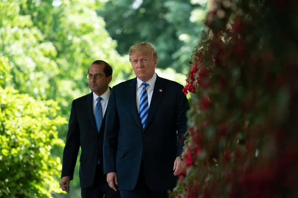 President Donald Trump and Health and Human Services Secretary Alex Azar arrive to deliver remarks on reducing drug costs in the Rose Garden.
