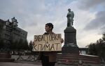 A solitary protester in Moscow holds a sign reading “Climate Strike” as a part of the Fridays for Future global climate strikes on Sept. 20.