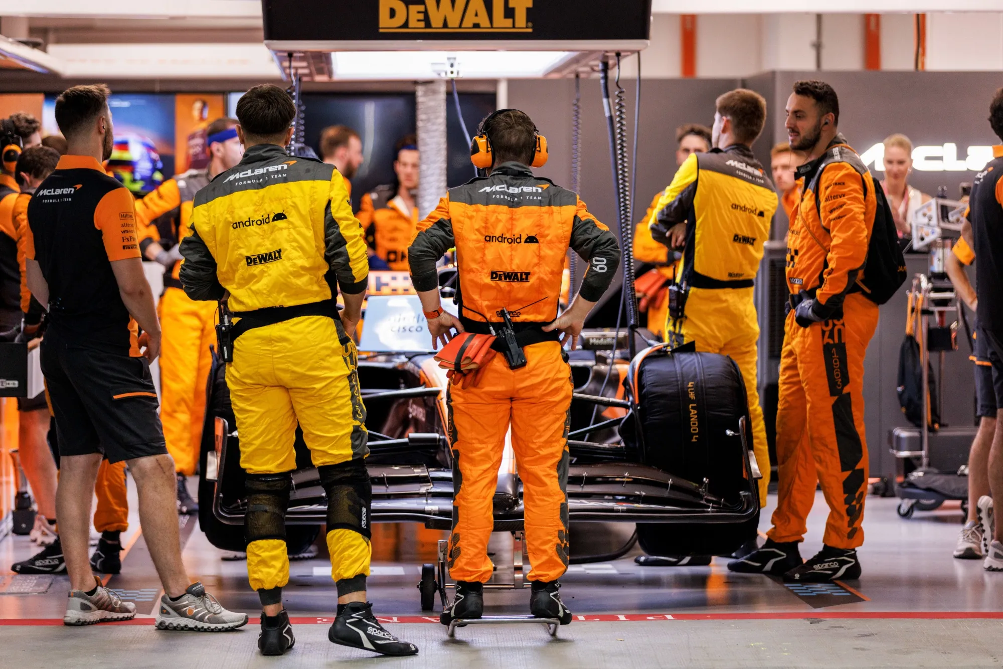 The McLaren team preparing the car in the pit garage in Singapore in 2023.