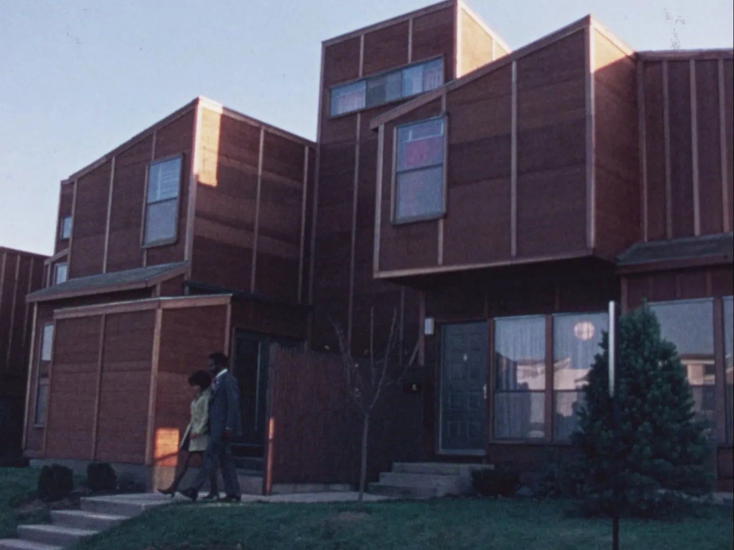 A video still from a 1976 federal government film about a sweeping promise to assembles millions of homes in factories.