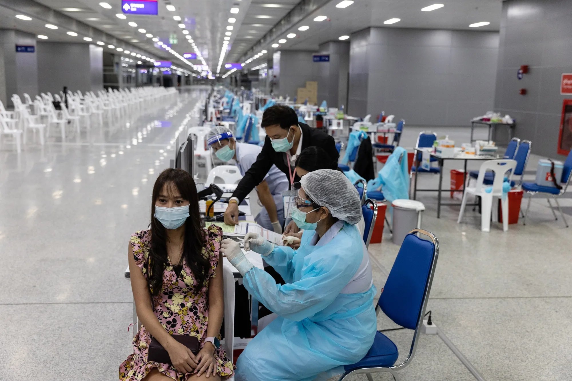 A health worker administers a dose of the Sinovac vaccine at a vaccination center set up at the Bang Sue Grand Station in Bangkok, on June 7.