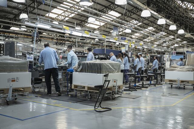 Workers assemble Samsung televisions at Mirgor's 388,000-square foot factory in Rio Grande.