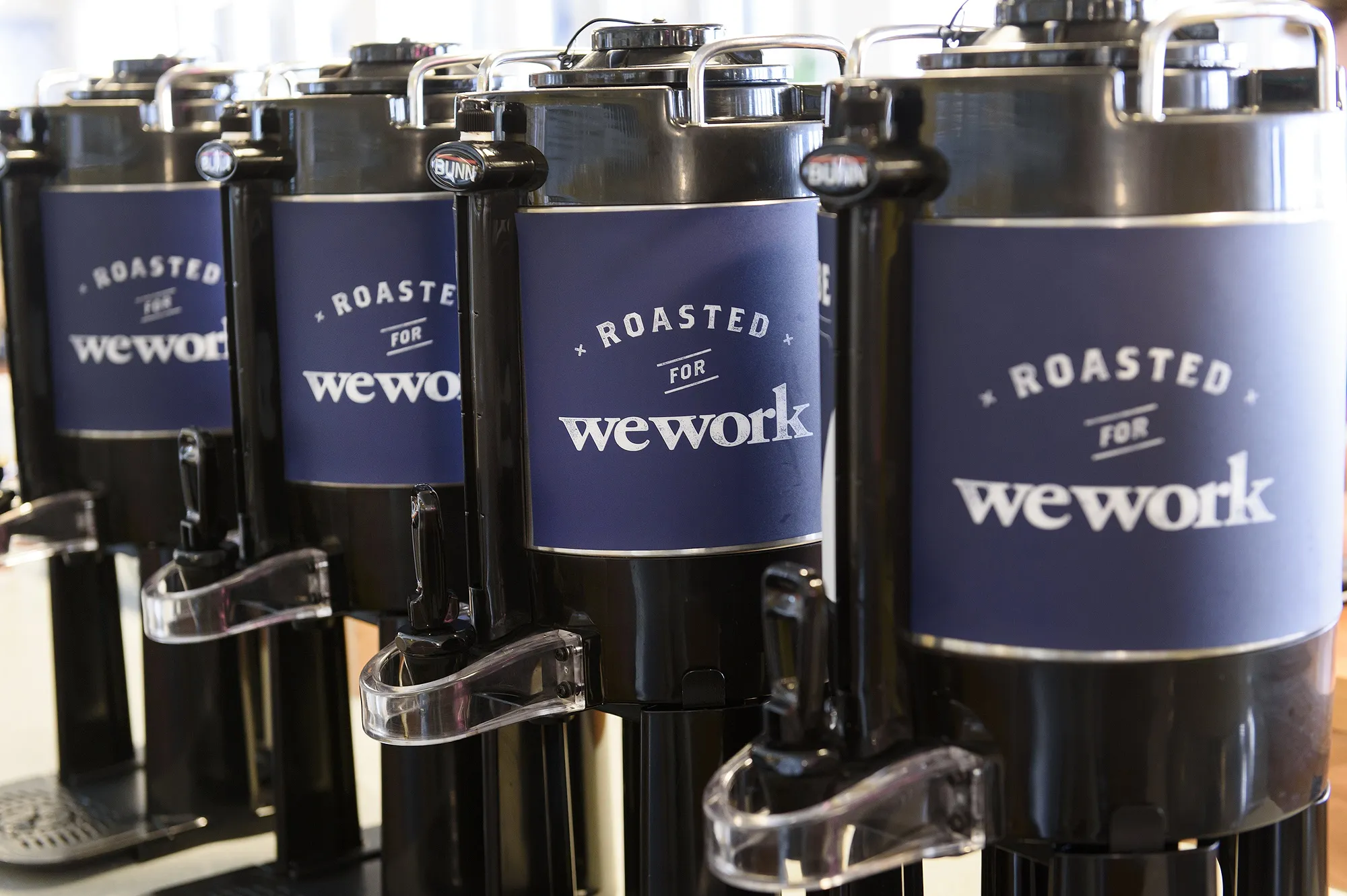 Coffee dispensers sit on a counter in a kitchen area at the Embarcadero WeWork Cos Inc. offices in San Francisco, California, U.S., on Thursday, Oct. 19, 2017. WeWork has focused its attention on Asia since 2016 with the opening of its first facility in Shanghai amid booming demand for flexible work spaces.