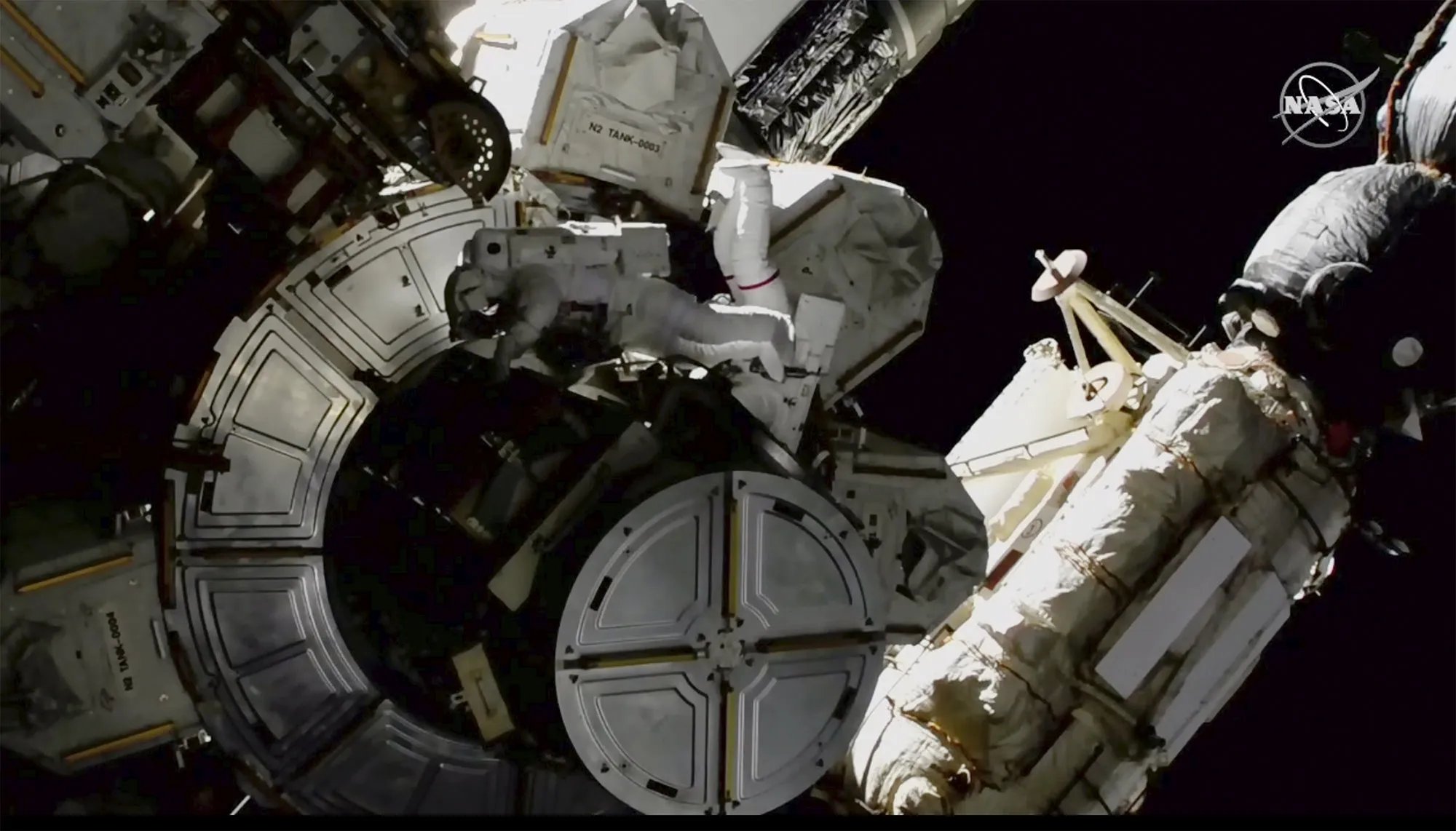 Victor Glover and Mike Hopkins on a spacewalk outside the International Space Station on March 13.