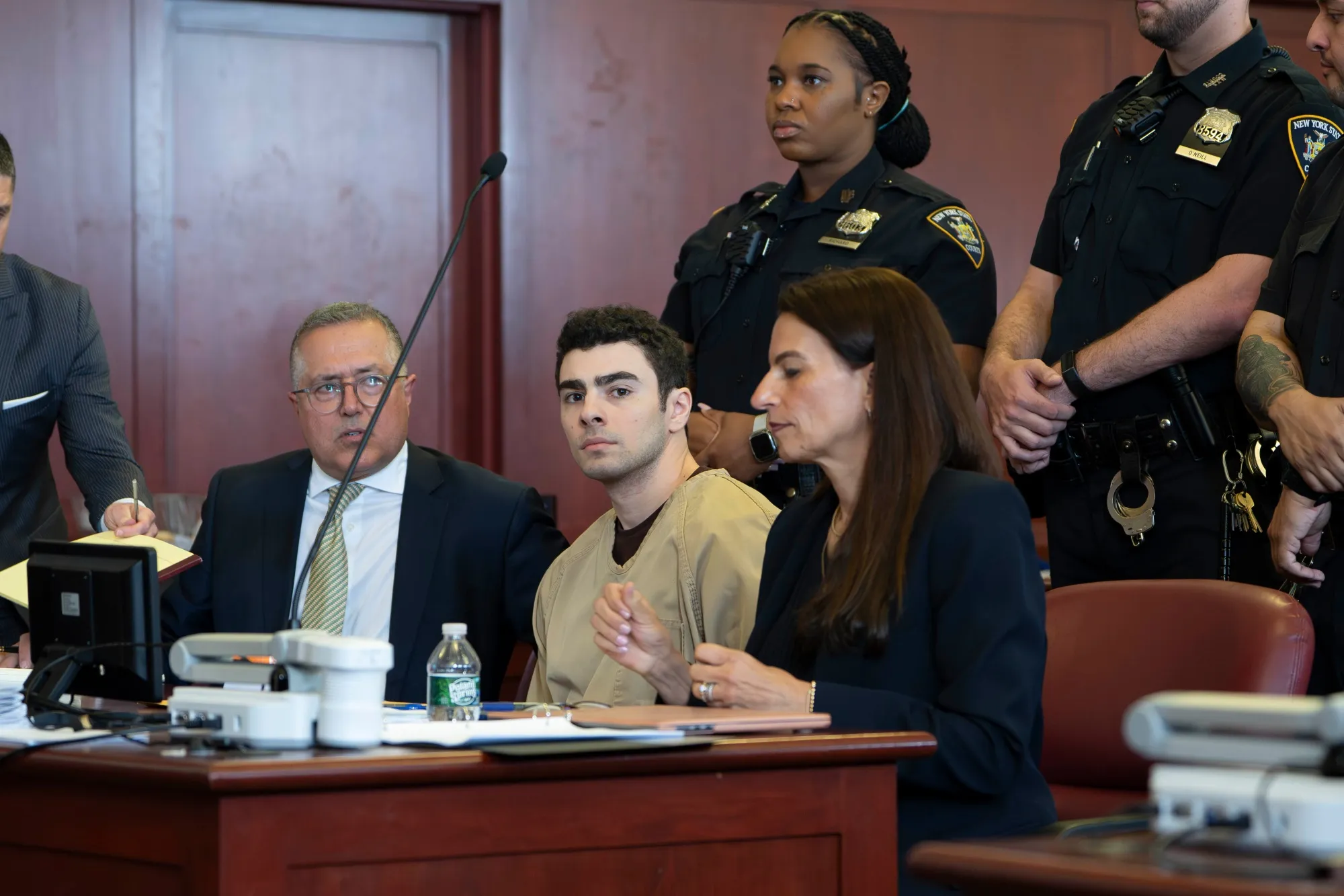 Luigi Mangione, center, attends a pretrial hearing at New York State Supreme Court on Sept. 16.