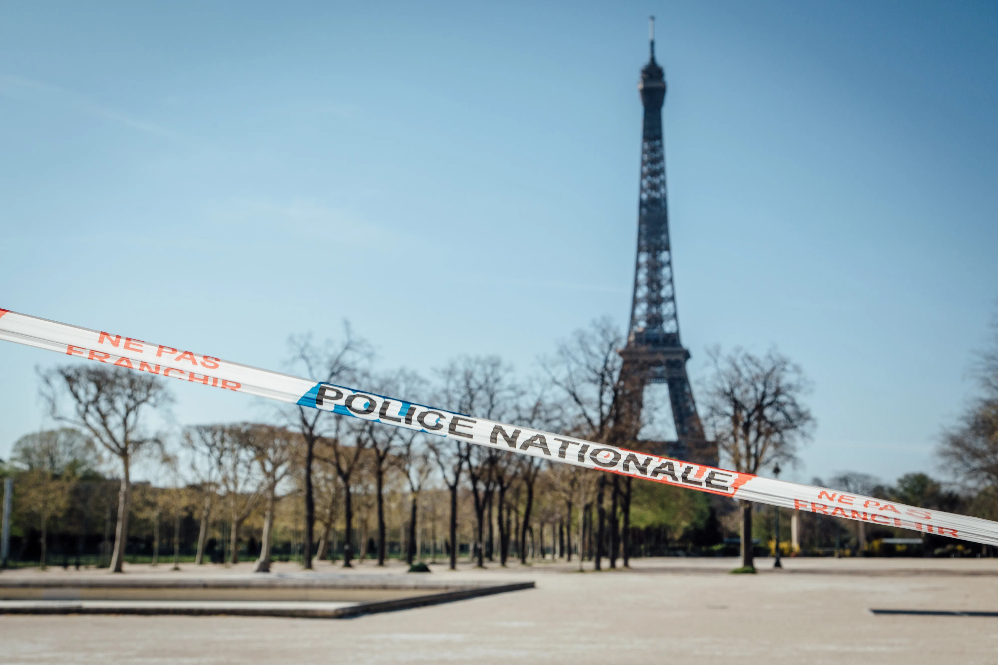 A police cordon blocks access to the Champs de Mars park near the Eiffel Tower.