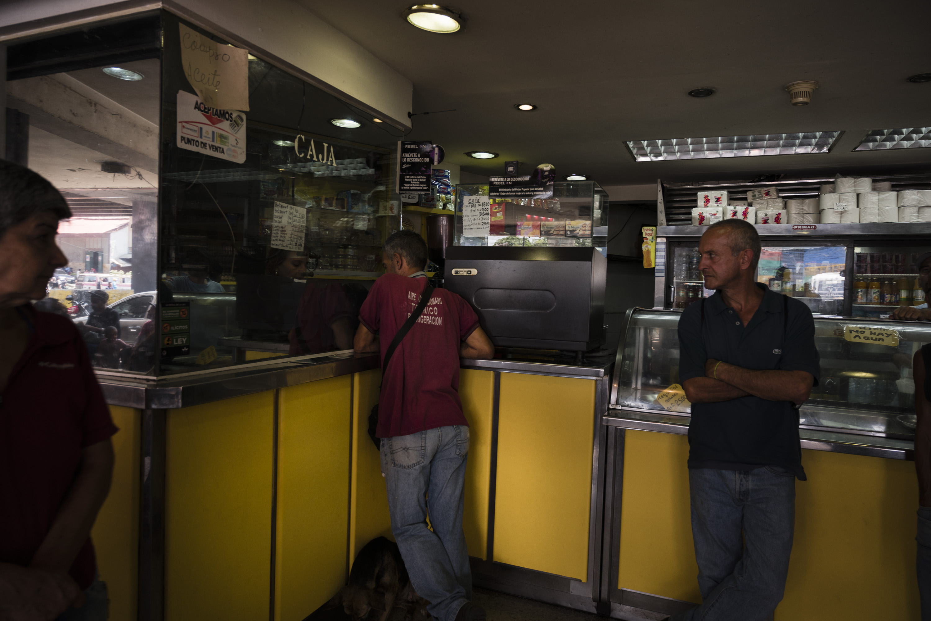 A customer pays for items at a bakery in Caracas, Venezuela, in March 26, 2019.&nbsp;