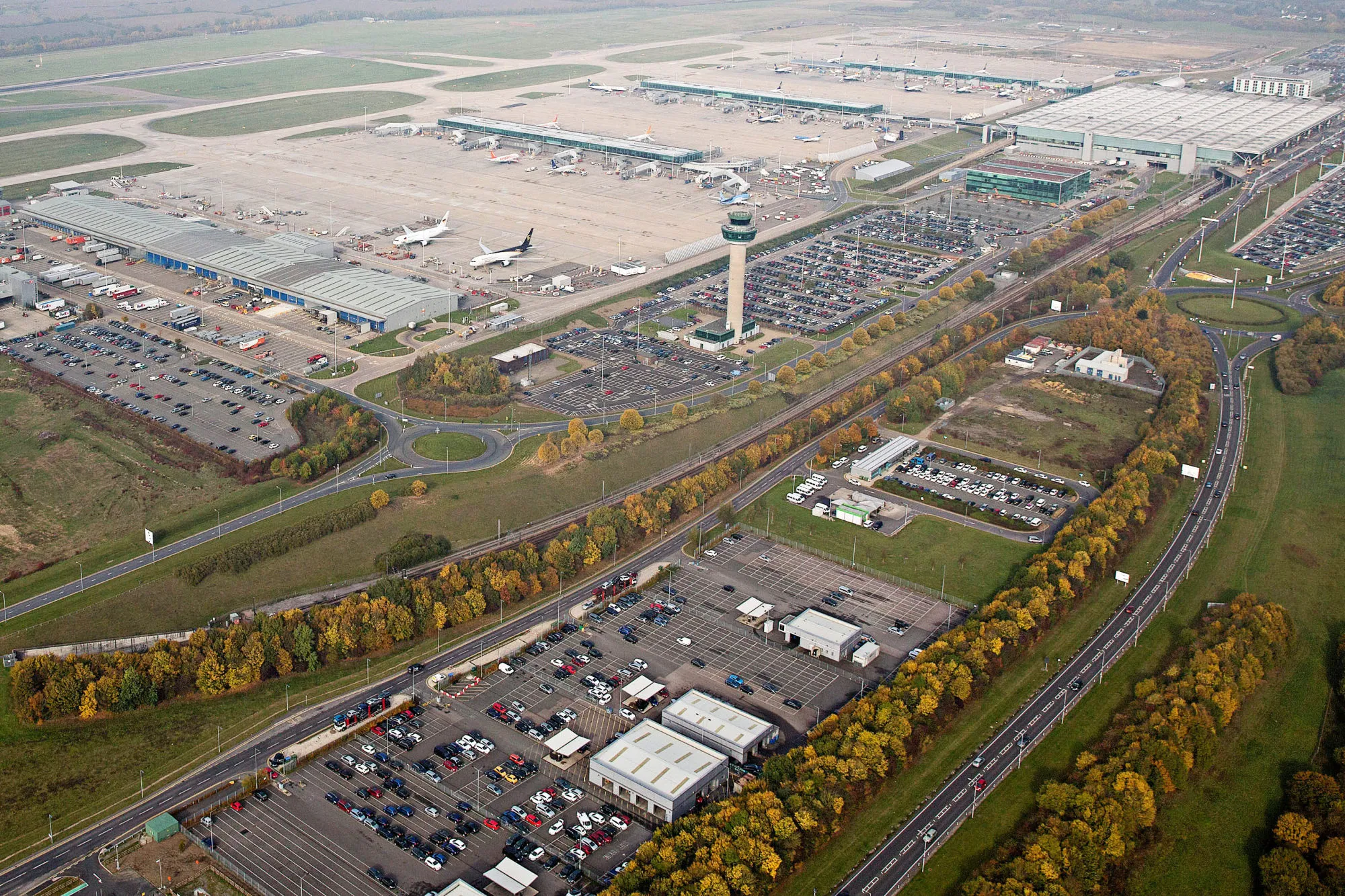 The control tower stands in the center of London Stansted Airport Ltd, operated by Manchester Airports Group Plc (MAG), in Stansted, U.K., on Tuesday, Oct. 27, 2015. European airlines must manage intense competition on short-, medium- and long-haul routes, limiting profit gains even with lower fuel prices.