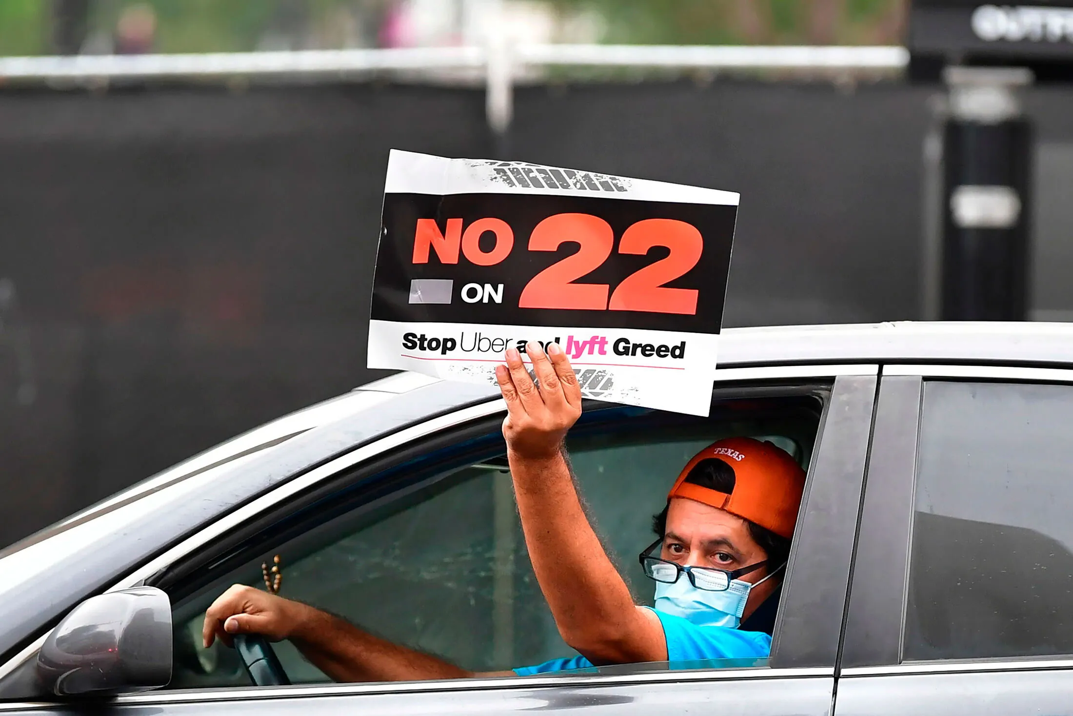 Uber and Lyft drivers protest in a caravan outside Los Angeles City Hall on Oct. 22, 2020.