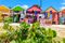 Multi colored wood cottages and tourist souvenir shops, Long Bay Beach, Antigua