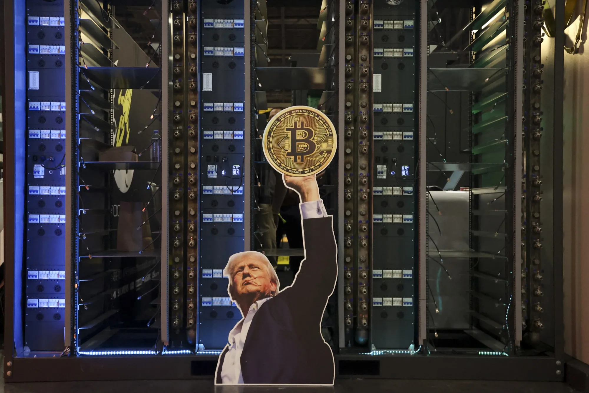 A cutout of US President Donald Trump holding a Bitcoin token during the Bitcoin 2025 conference in Las Vegas on May 27. Photographer: Ian Maule/AFP/Getty Images