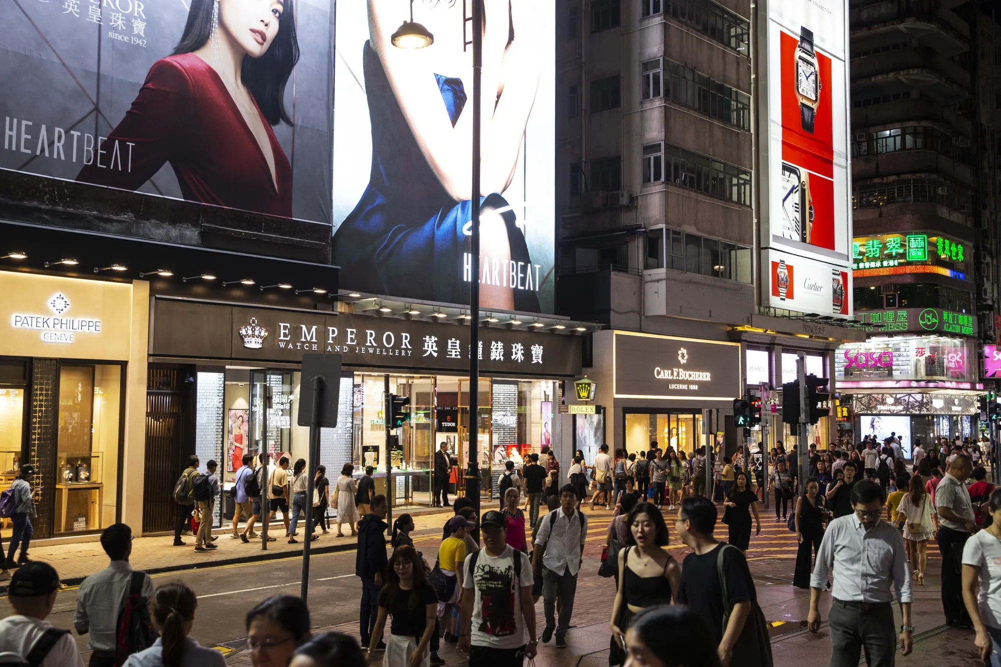 Pedestrians walk along Russell Street in the Causeway Bay district of Hong Kong, on Aug. 29.