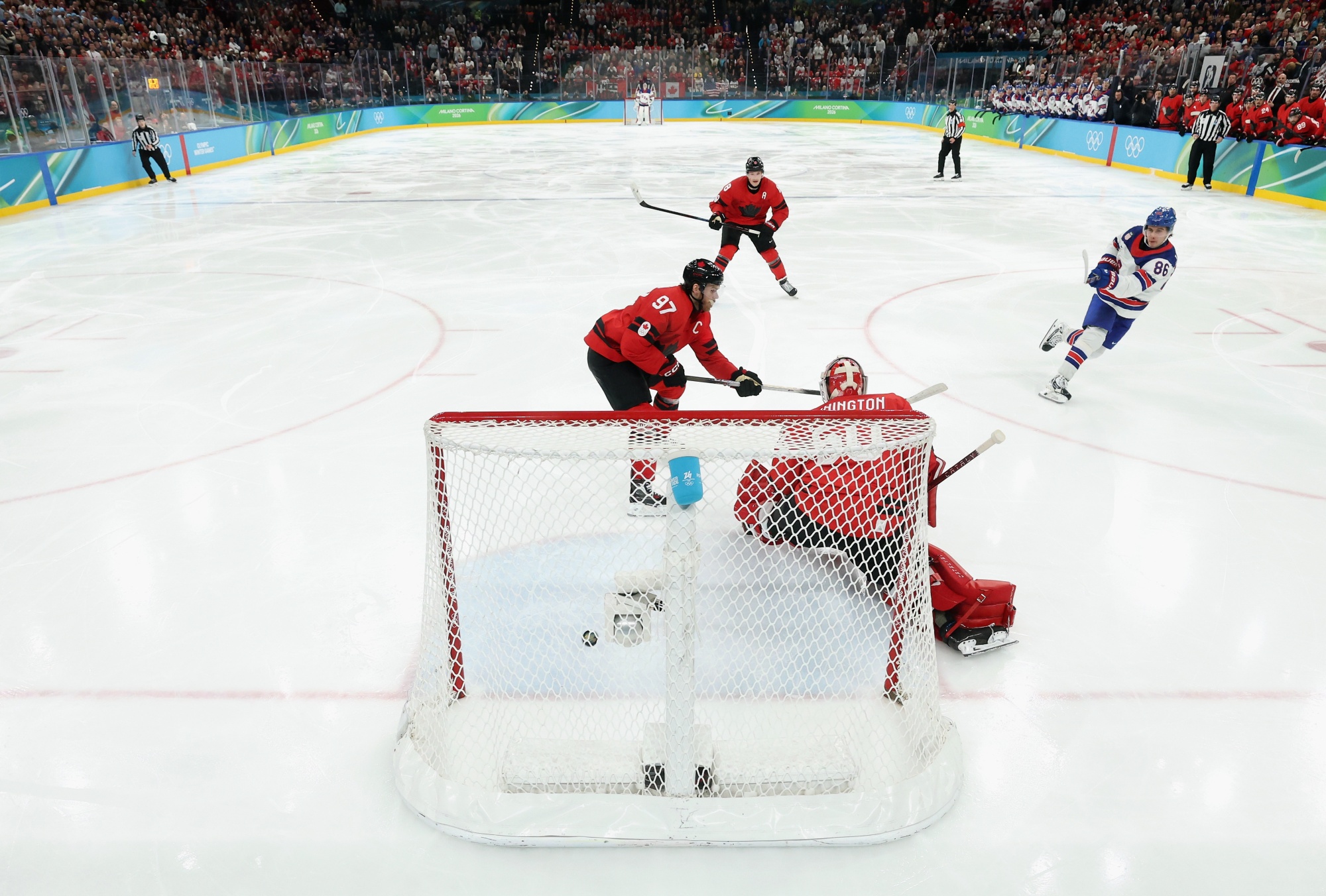 Jack Hughes, #86 of Team United States, scores the game-winning goal in overyime against Team Canada during the Men's Gold Medal match of the Milano Cortina 2026 Winter Olympic games. Photographer: Bruce Bennett/Getty Images