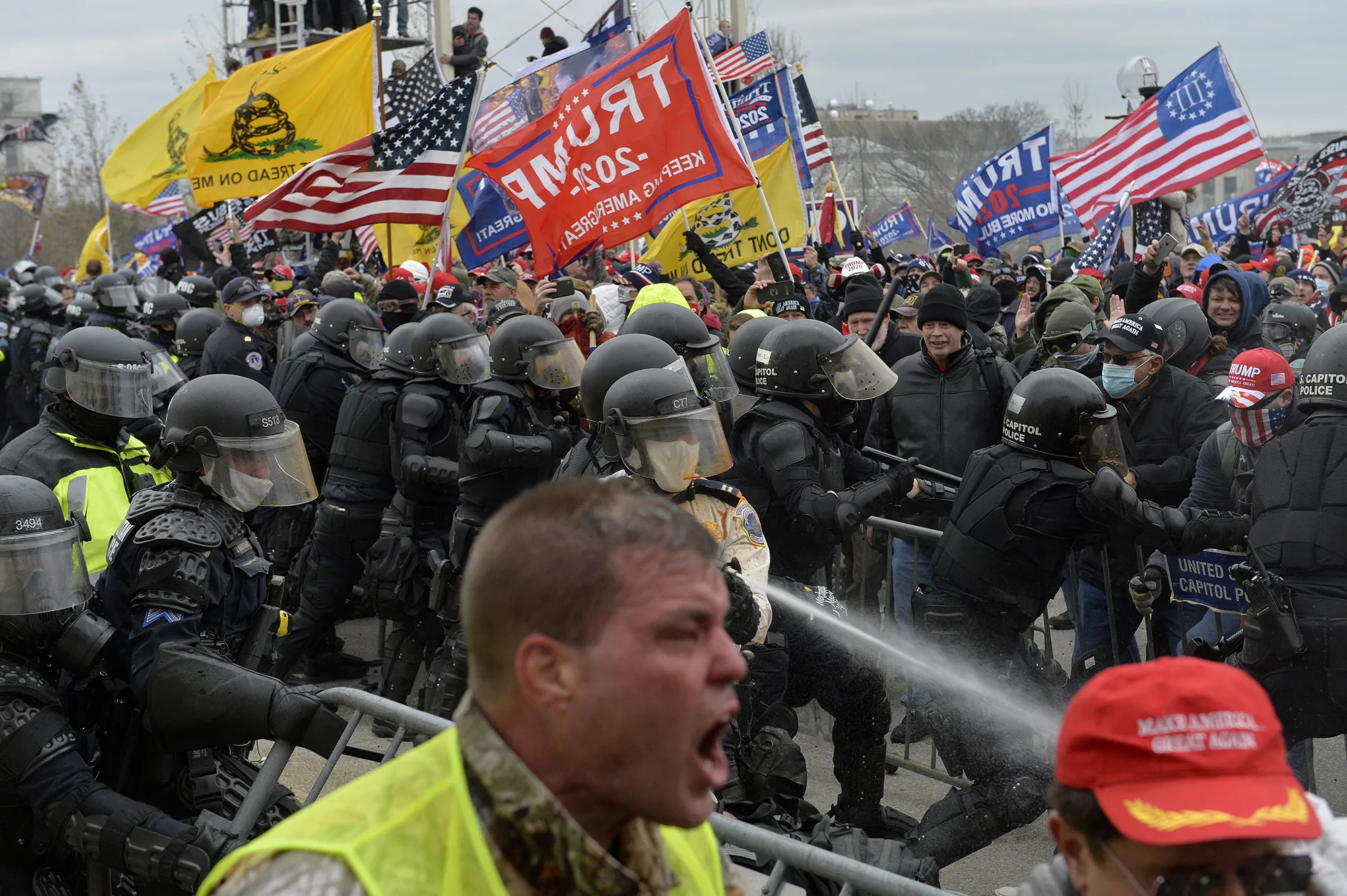 Followers of Donald Trump are confronted by police as they attack the US Capitol in Washington on Jan. 6, 2021. Trump was impeached a second time over his role in alleged efforts to block the transfer of power to President Joe Biden.