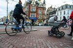 A street in Amsterdam shows a mix of pedestrians and bikes —&nbsp;and few cars.&nbsp;
