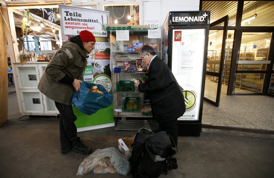 A food sharing supporter brings provisions found during dumpster diving to a distribution point in Berlin in 2013.