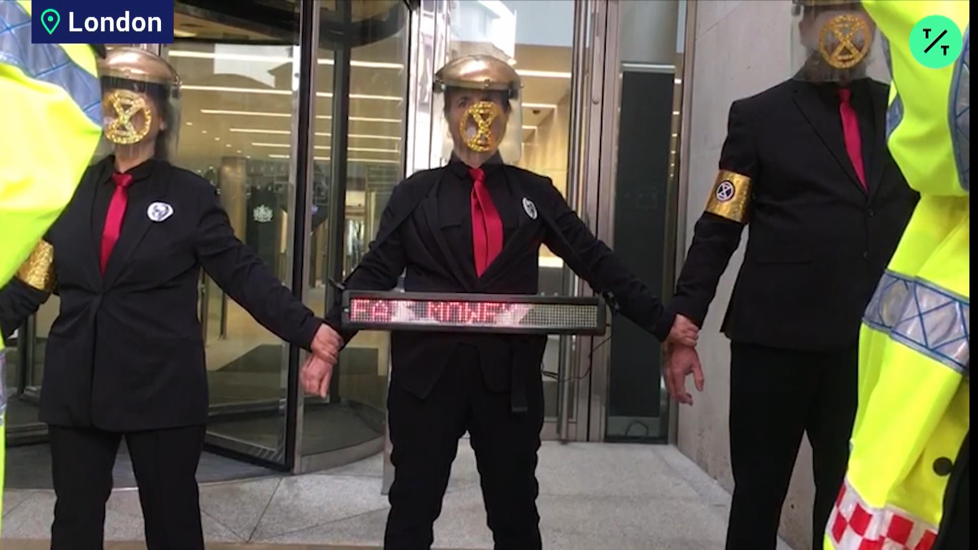 Masked Climate Protesters Glue Hands Bloomberg