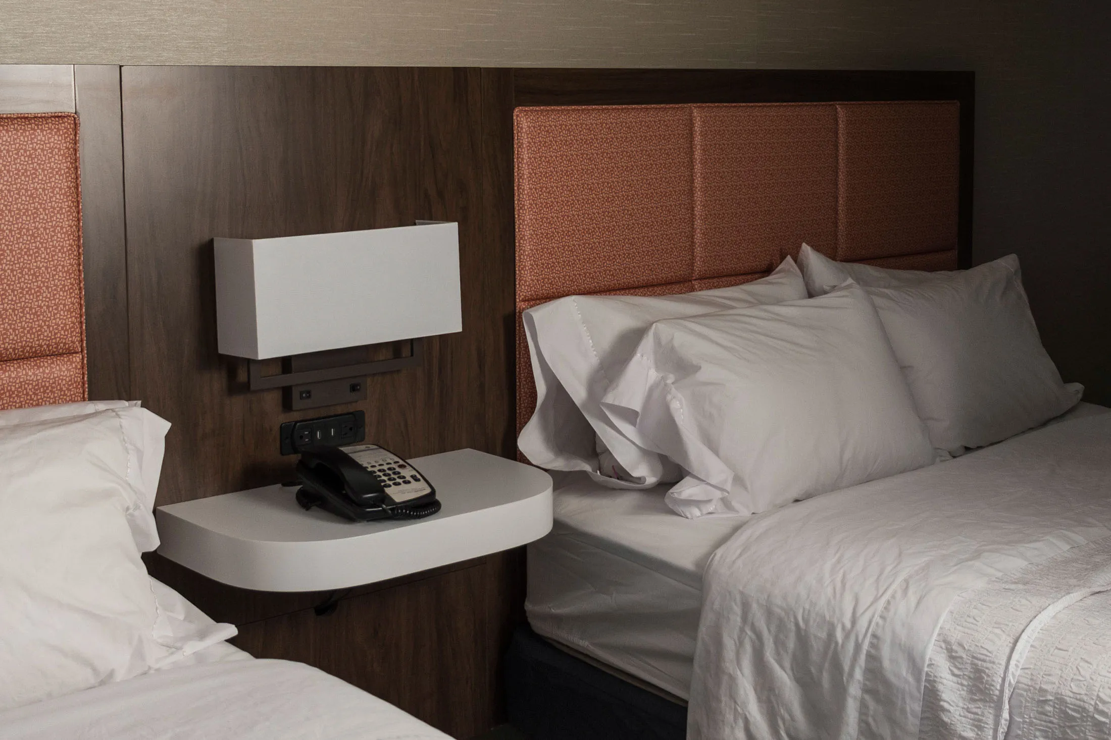 At a location in Farmington, New Mexico, the white bedspreads are meant to show dirt at a glance.