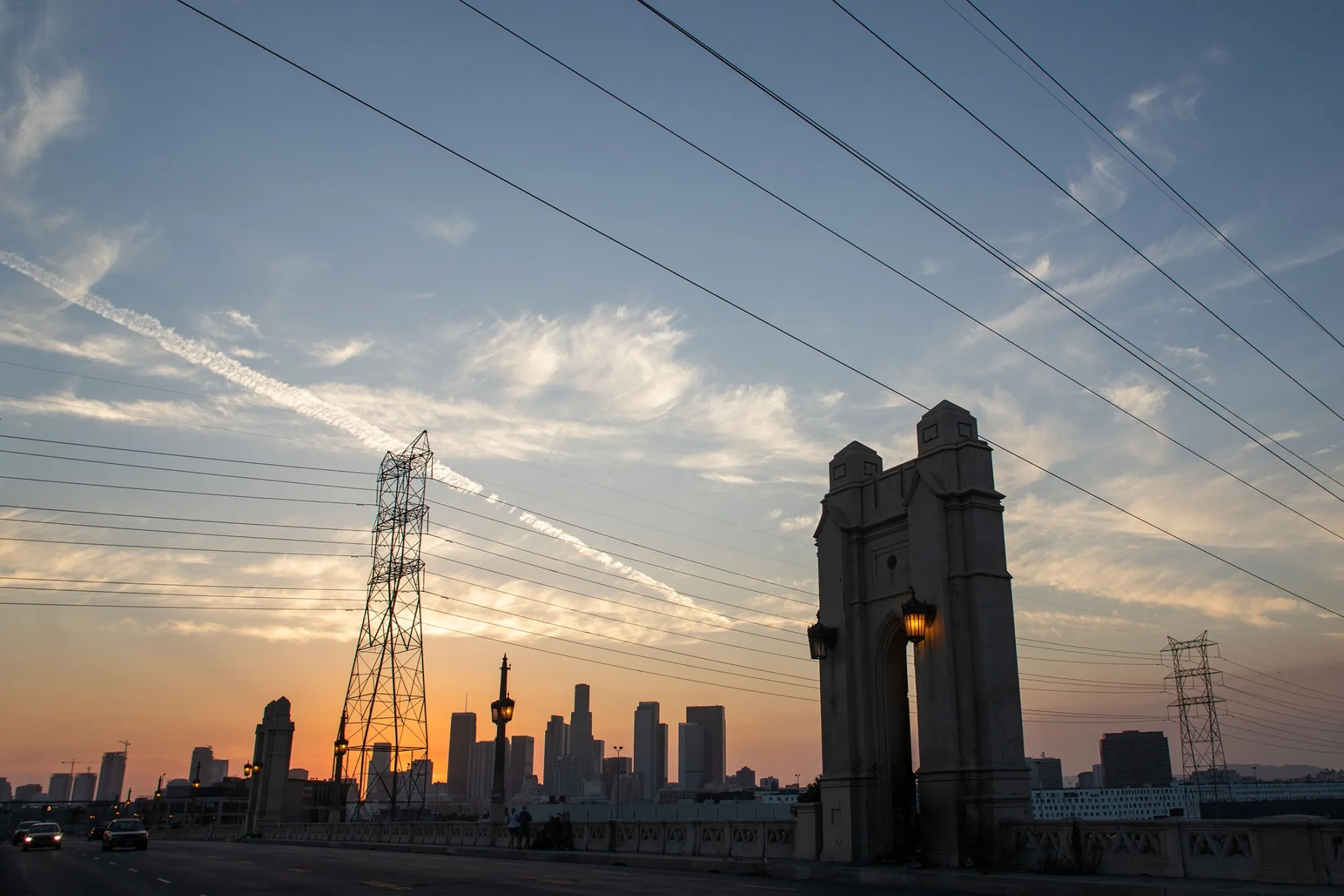 The Los Angeles skyline is seen behind transmission lines on Aug. 16.