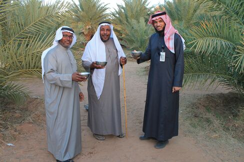 Farmer Ahmed Al Masoud offers visitors fresh camel milk.