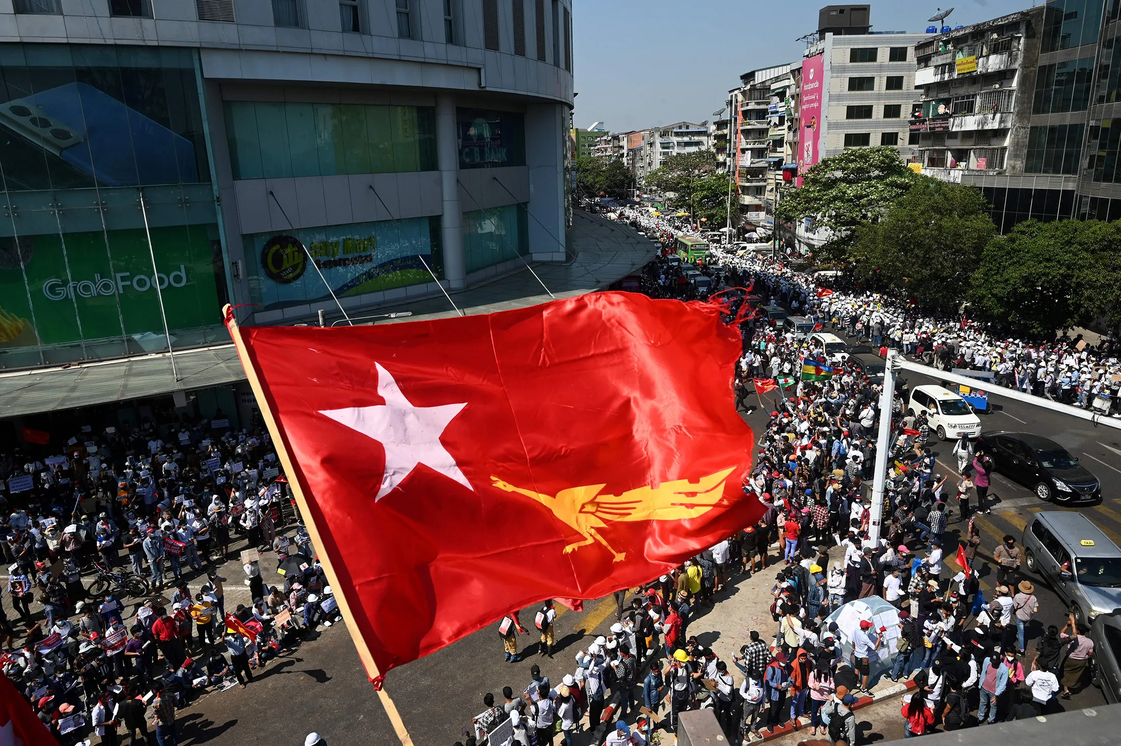 Demonstrators take part in a rally&nbsp;in Yangon, on Feb. 10.
