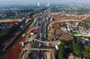 Cranes stand at a construction site as vehicles travel along the Jakarta-Serpong Toll Road in this aerial photograph taken in Jakarta, Indonesia, on Friday, Feb. 1, 2019. Indonesia is scheduled to release fourth-quarter gross domestic product (GDP) figures on Feb. 6.