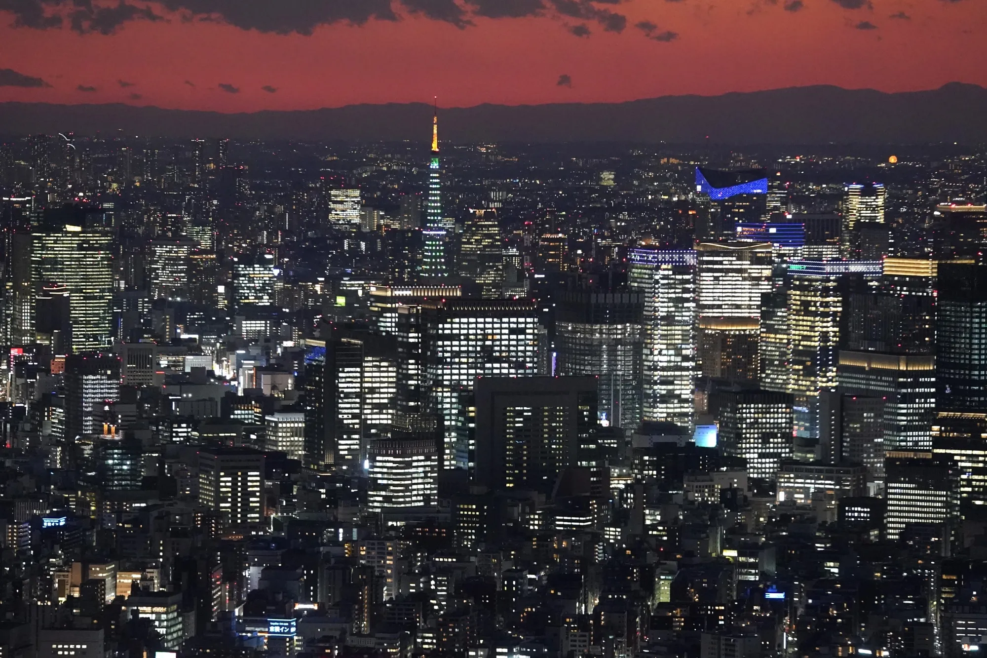 Residential and commercial buildings light&nbsp;up the night in Tokyo.