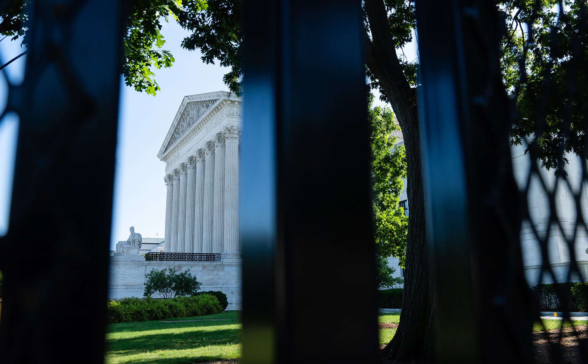 The Supreme Court through security fencing in Washington, D.C.
